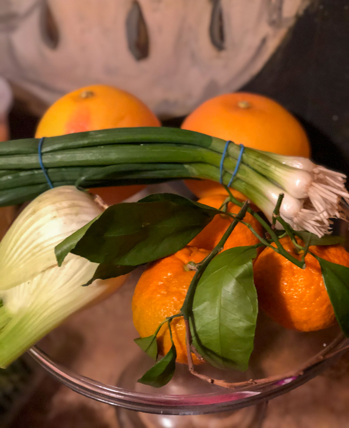pretty oranges on vintage glass cake pedestal