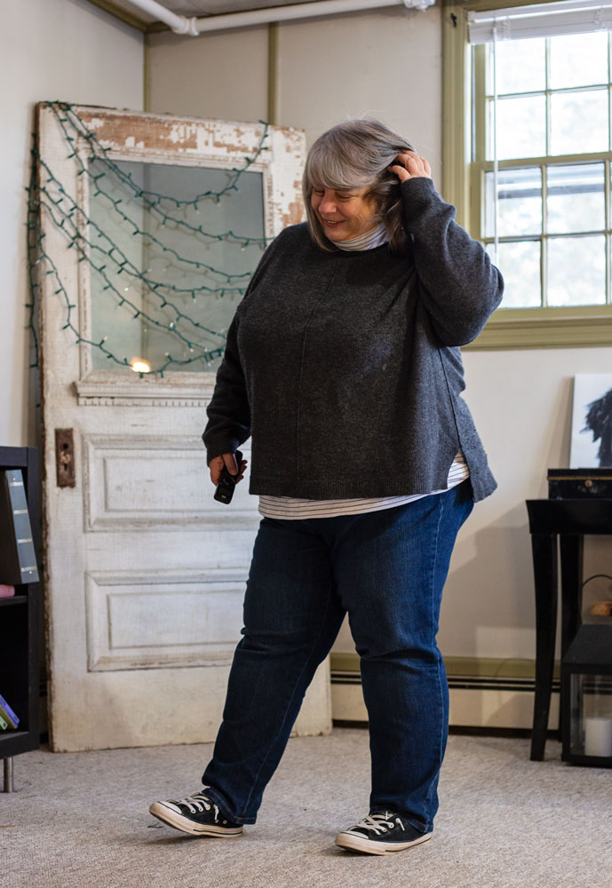 bettye in grey sweater in living room