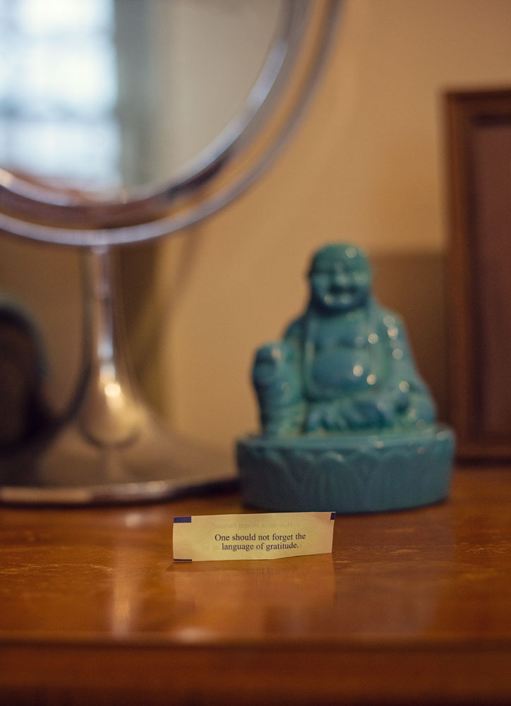 turquoise buddha figurine with mirror and cookie fortune