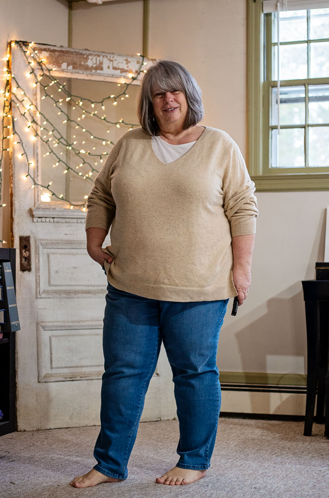 bettye in front of antieuq door with twinkle lights