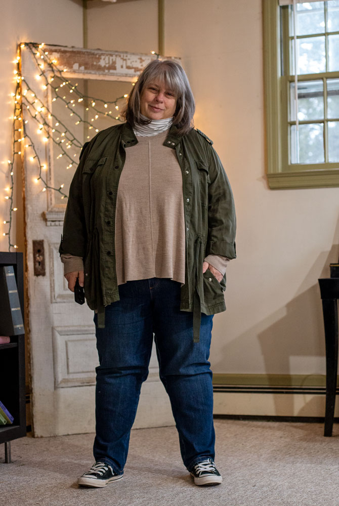 bettye in the living room in green jacket