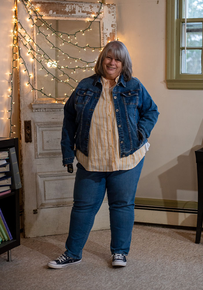 bettye in front of antique door with twinkle lights